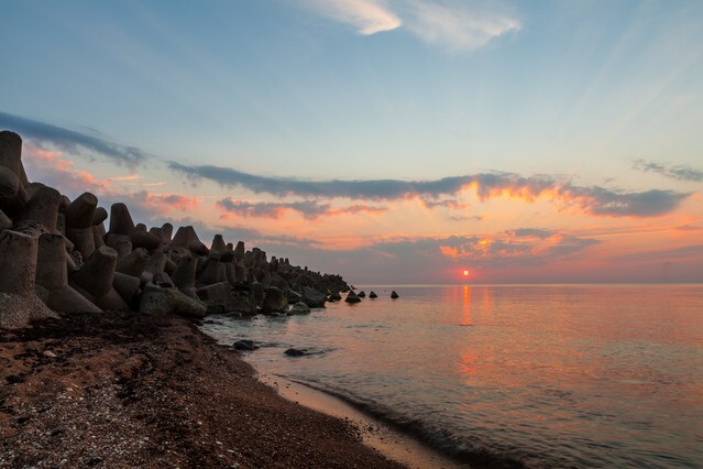 Concrete tetrapods at sunset on the Baltic sea in Liepaja